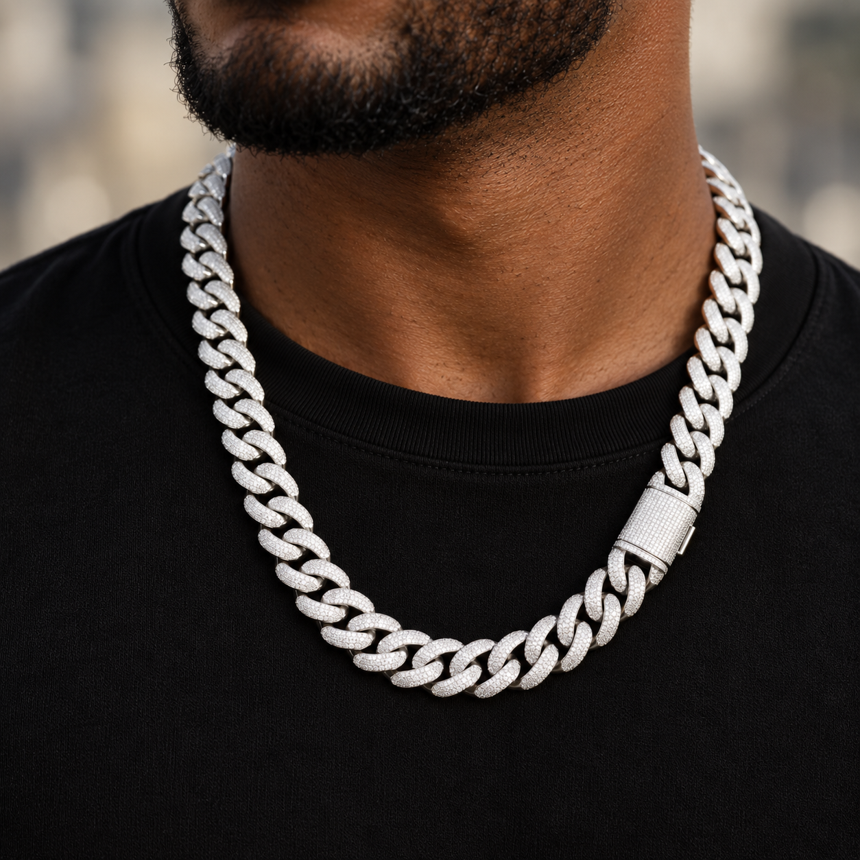 20 mm iced out Cuban link chain worn over a black t-shirt, fully pave-set links